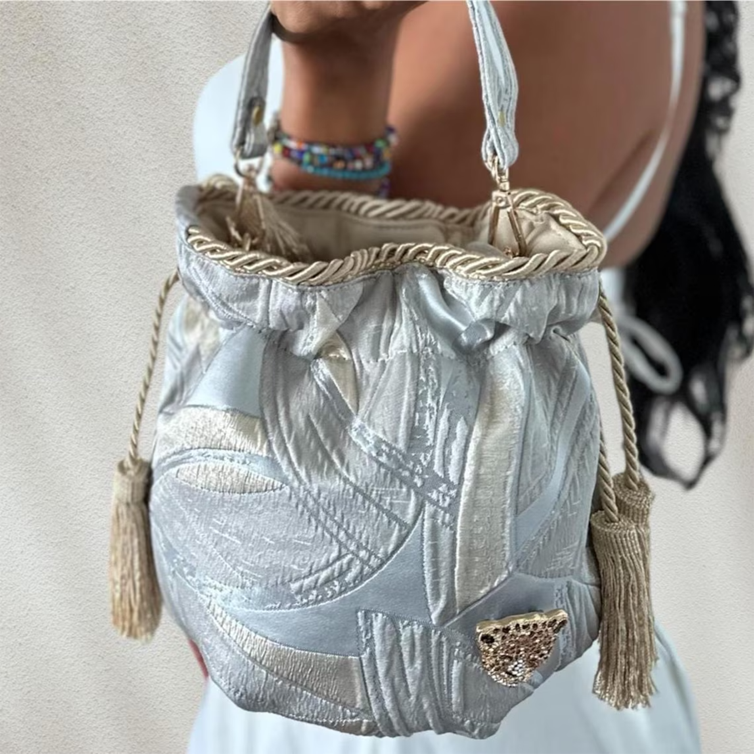 Pale Silver Gold Jacquard Mini Bucket Pouch With Rope Trim Tassel Drawstring, Dual Carry Fixtures And Detachable Crystal Animal Embellishment
