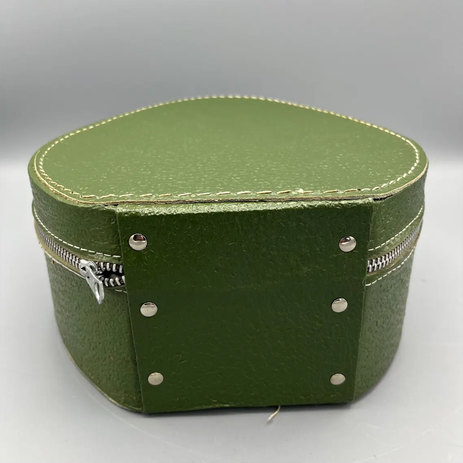 Deep Green Pebble Textured Egg Shaped Retro Vanity Case With Wrap-Around Metallic Zip, Cream Lining And Slim Loop Wrist Carry Strap