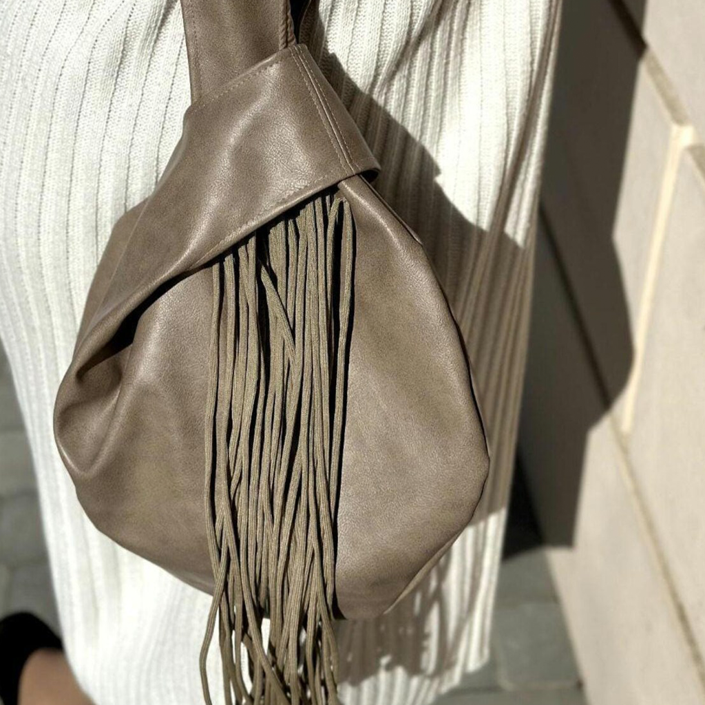 Muted Taupe Knotted Handle Slouchy Pouch With Cascading Matching Tassels, Hidden Zip Closure And Inner Divider Storage Slot Handbag