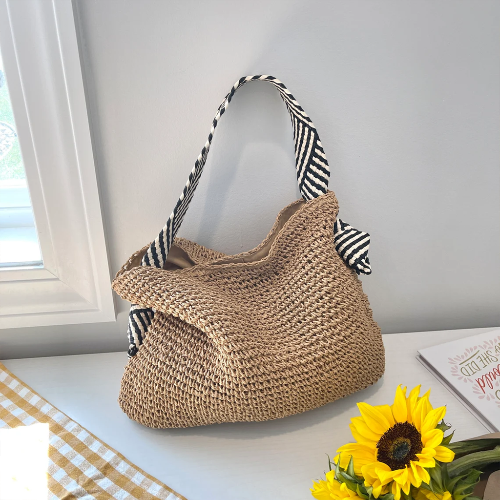 Natural Tan Open Weave Slouchy Tote With Striped Black White Fabric Shoulder Band, Snap Fastener Flap And Smooth Neutral Inner Lining