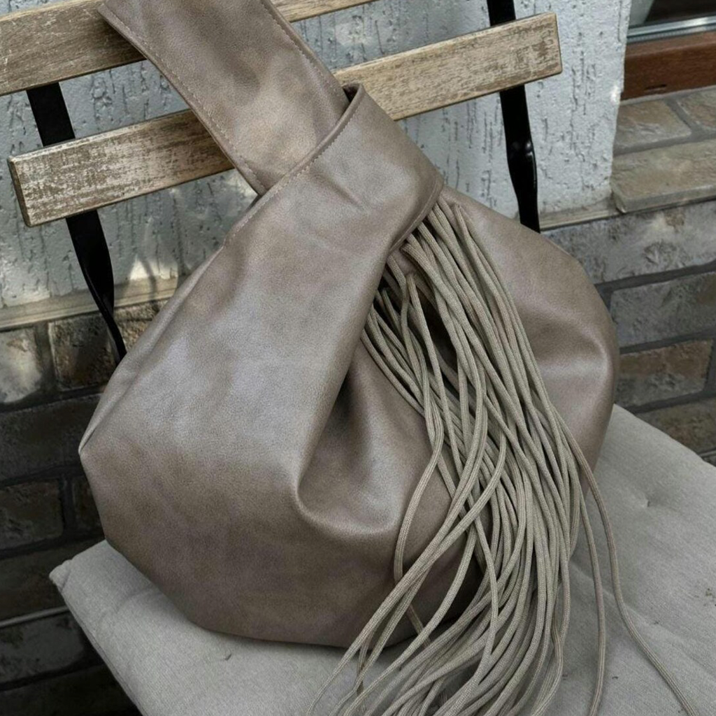 Muted Taupe Knotted Handle Slouchy Pouch With Cascading Matching Tassels, Hidden Zip Closure And Inner Divider Storage Slot Handbag