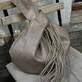 Muted Taupe Knotted Handle Slouchy Pouch With Cascading Matching Tassels, Hidden Zip Closure And Inner Divider Storage Slot Handbag