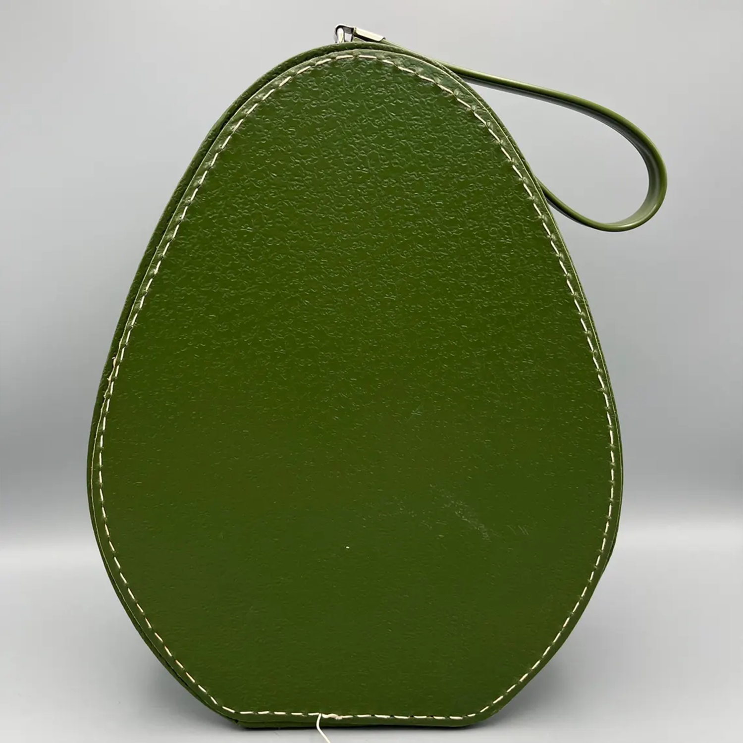 Deep Green Pebble Textured Egg Shaped Retro Vanity Case With Wrap-Around Metallic Zip, Cream Lining And Slim Loop Wrist Carry Strap